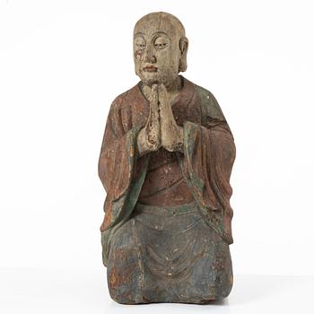 A Chinese sculpture of a louhan, 20th century.