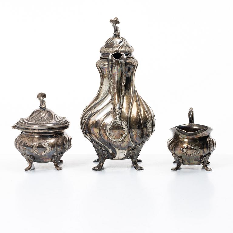 C.G. Hallberg, A three piece Roccoco style silver coffee service, Stockholm 1946.