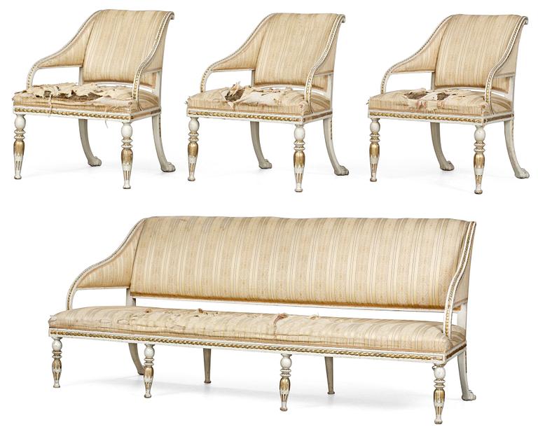 A late Gustavian suite of furniture comprising three armchairs and a sofa.