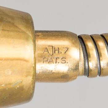 A mid 20th century floor lamp, marked AJH.7.