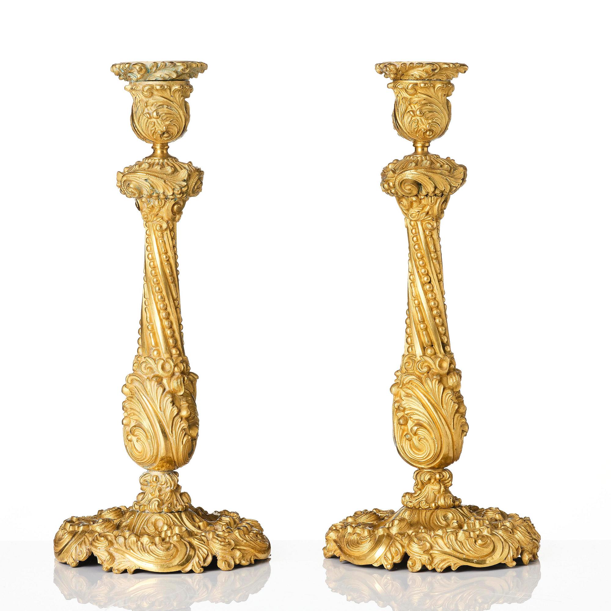 A pair of gilt-bronze rococo-revival candlesticks, later part 19th century.