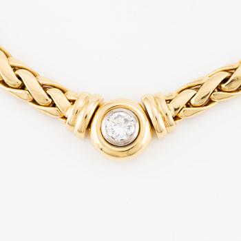 A necklace/bracelet combination in 18K gold set with a round brilliant-cut diamond ca 0.35 ct.