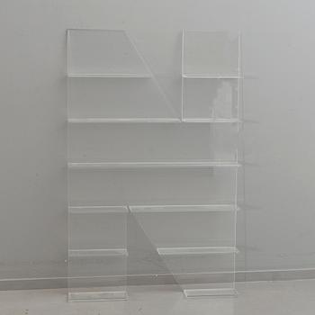 Shelf, plexi glass, in the shape of the letter 'N',Non Violence.