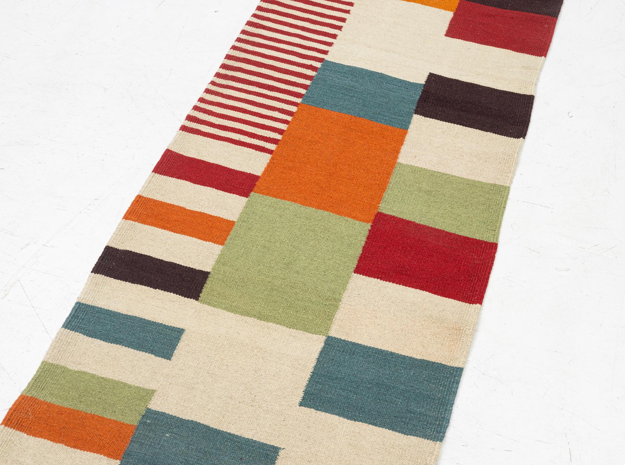 A Kilim runner, c. 388 x 80 cm.