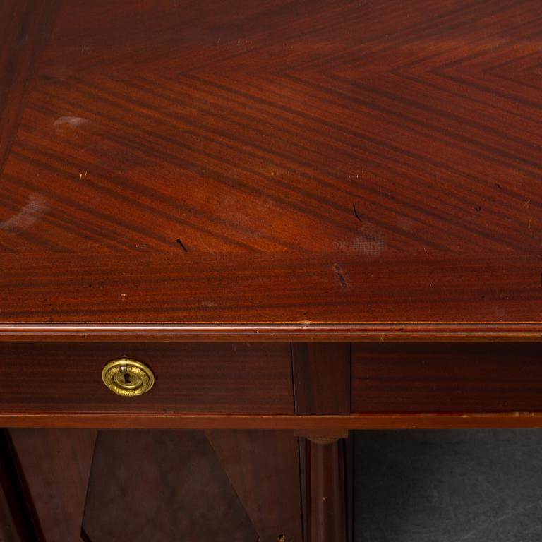 An early 20th century writing desk with chair.