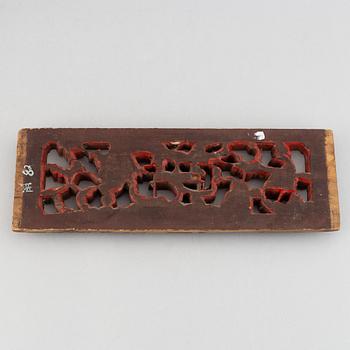 A Chinese gilt and wooden panel depicting Dragon gate, Qing dynasty, late 19th/early 20th century.