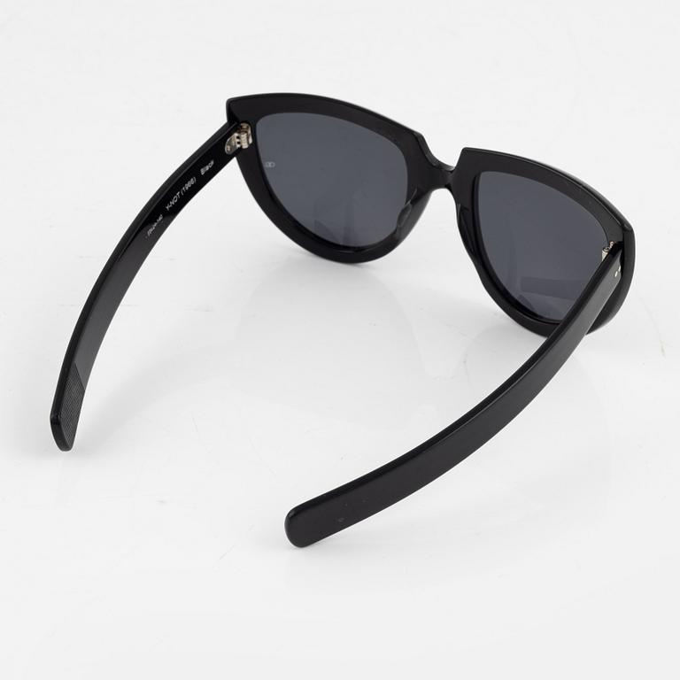 Oliver Goldsmith, a pair of black "Y-not" sunglasses.