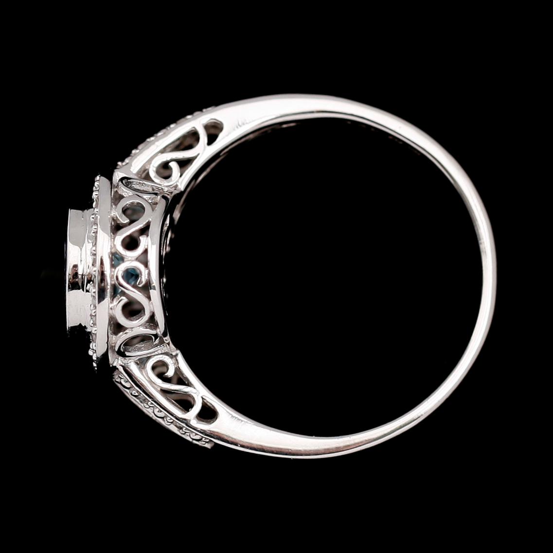 RING, 14 k vitguld, blå topas, diamanter tot 0.12 ct.