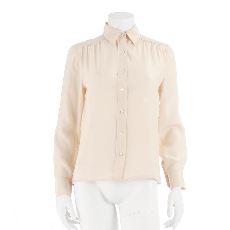 CÉLINE, a créme colored silk blouse, size 40.