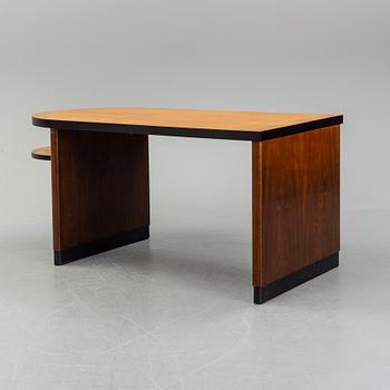 Axel Einar Hjorth, attributed to. A walnut and birch desk, Nordiska Kompaniet, 1930's.
