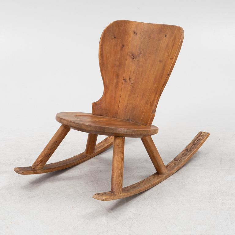 A 1940's pinewood rocking chair.