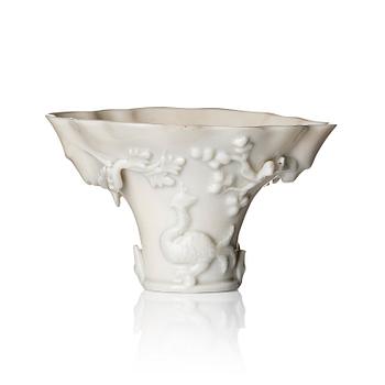 A blanc de chine rhinoceros libation cup, Qing dynasty, Kangxi (1662-1722).