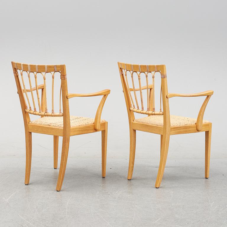 A pair of mahogany armchairs, model 1165, designed by Josef Frank in 1946 for Firma Svenskt Tenn.