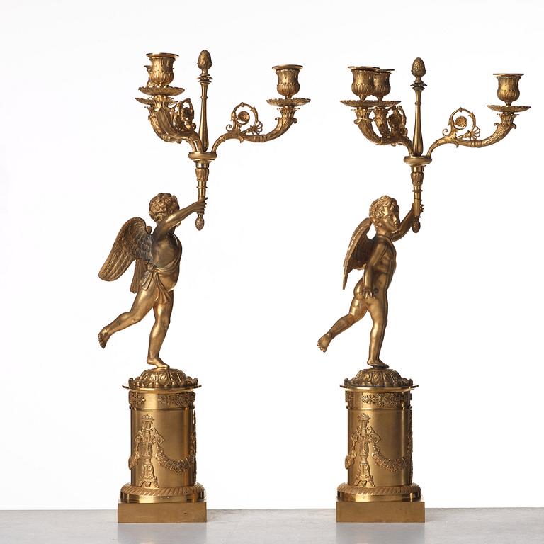 A pair of French Empire three-light candelabra, early 19th century.