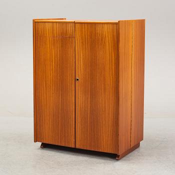 A mahogany veneered convertible cabinet, mid 20th Century.
