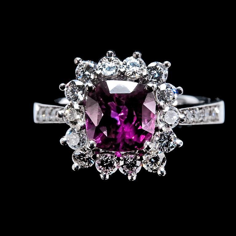 A RING, ruby c. 2.60 ct and diamonds c. 0.86 ct.