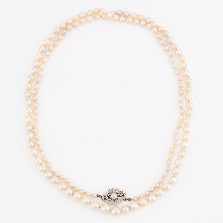 Pearl necklace, with graduated pearls, clasp set with a half-pearl and old-cut diamonds.