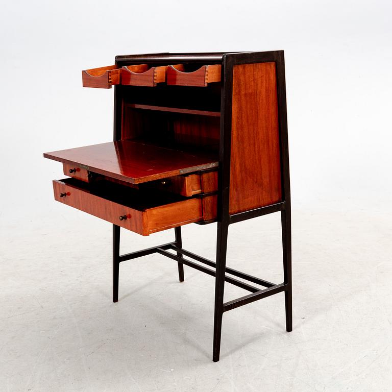 A 1950s mahogany writing desk.