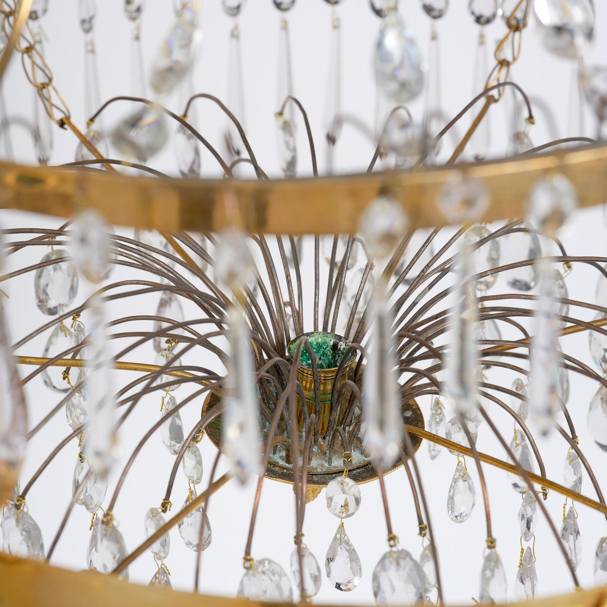 A late Gustavian gilt brass and cut glass seven-light chandelier, Stockholm, late 18th century.