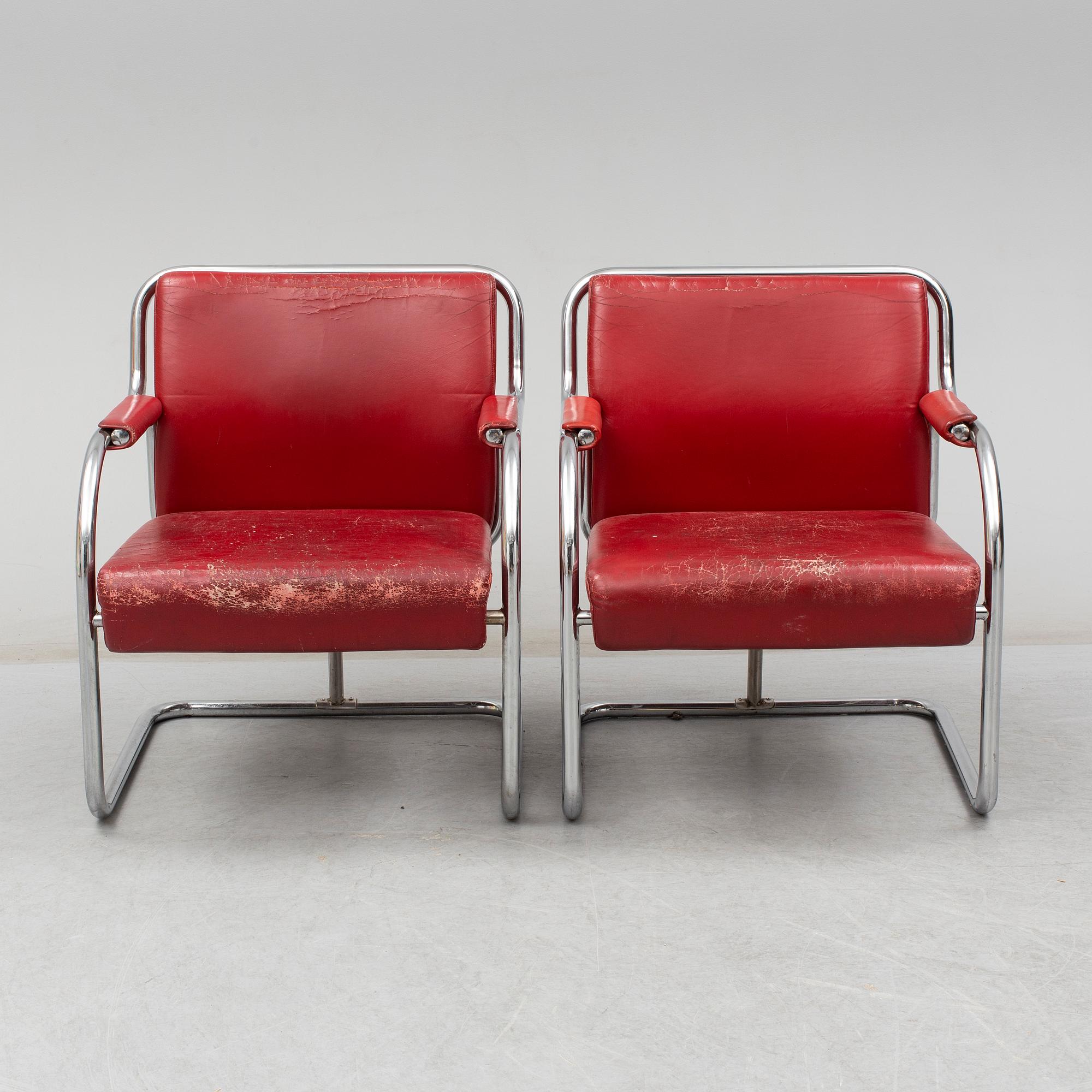 A pair of 1920s armchairs.