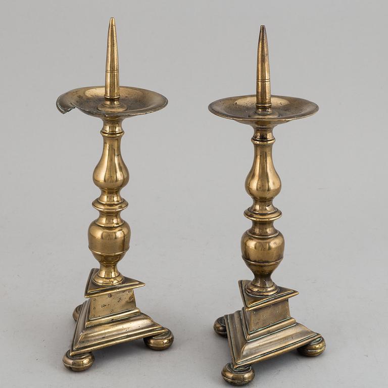 A pair of 17th century bronze candlesticks.