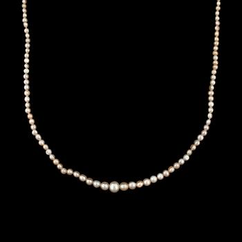 A natural pearl necklace. Ø 2 - 6.5 mm. Clasp set with a black opal.