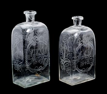 BRÄNNVINSPLUNTOR, 2 st, glas, daterade 1842.