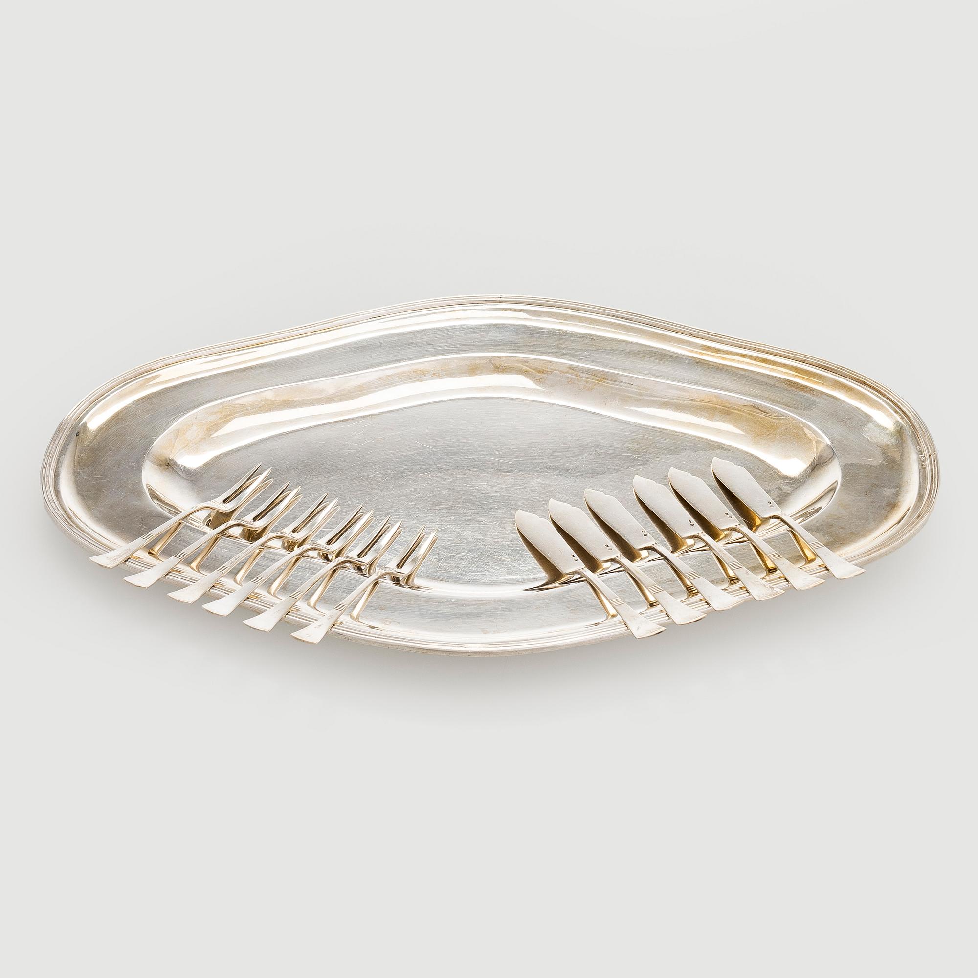 Serving platter, silver, Czechoslovakia, and twelve serving utensils, Alexander Sturm, Austria-Hungary, 1867-1941.