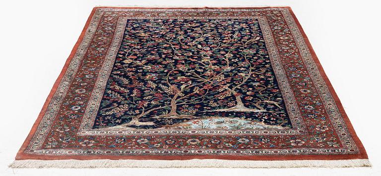 A signed pictoral silk Qum rug, c. 203 x 127 cm.