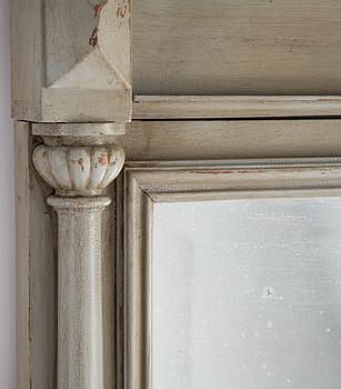 A painted mirror with console table from around the year 1900.