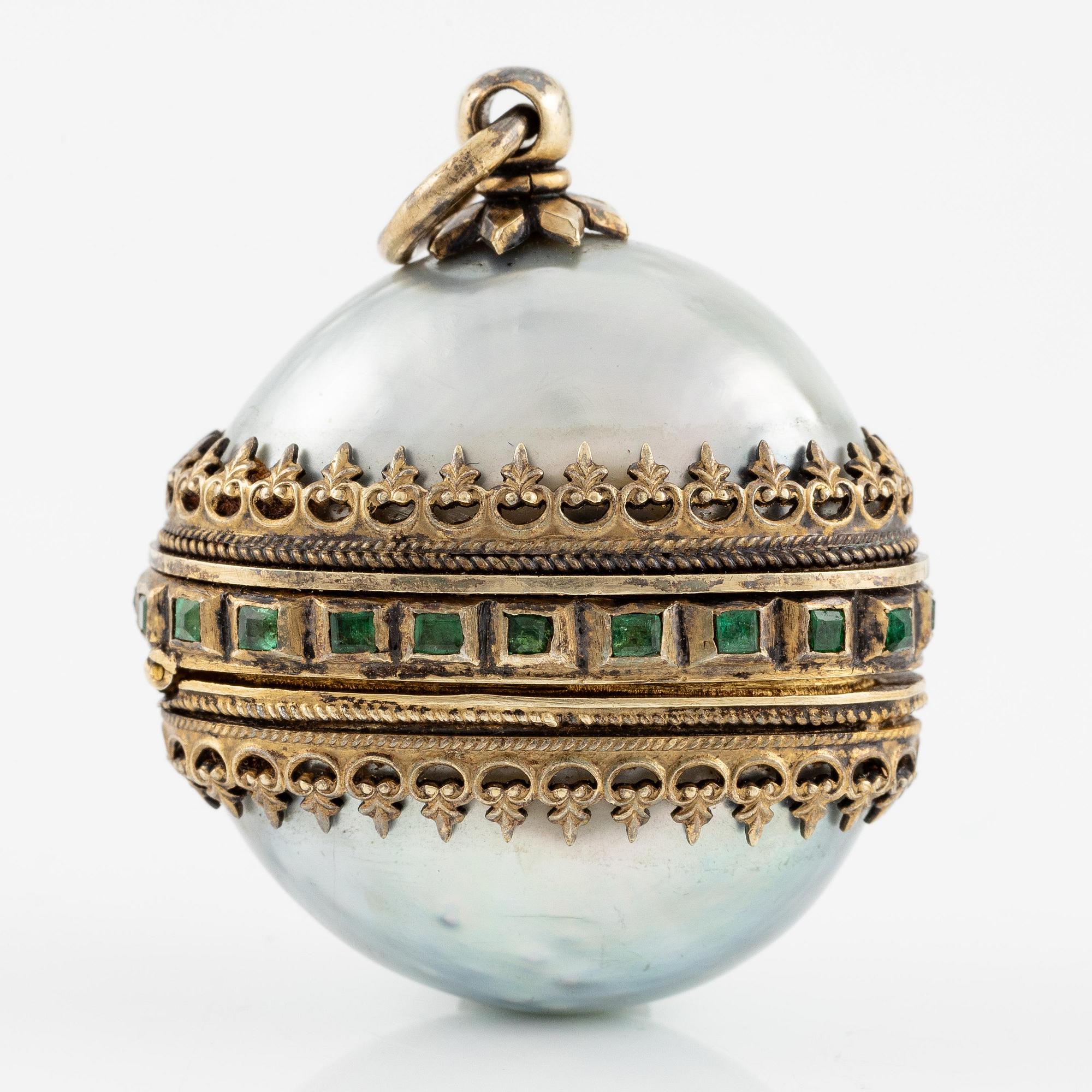 An Austrian-Hungarian pendant, parcel-gilt 750/1000 silver, emeralds and mother of pearl, Pest 1867-1922.