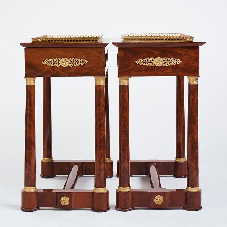 A pair of French Empire gilt bronze-mounted mahogany jardinieres, first half of the 19th century.