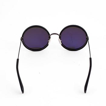 A pair of Yohji Yamamoto sunglasses.