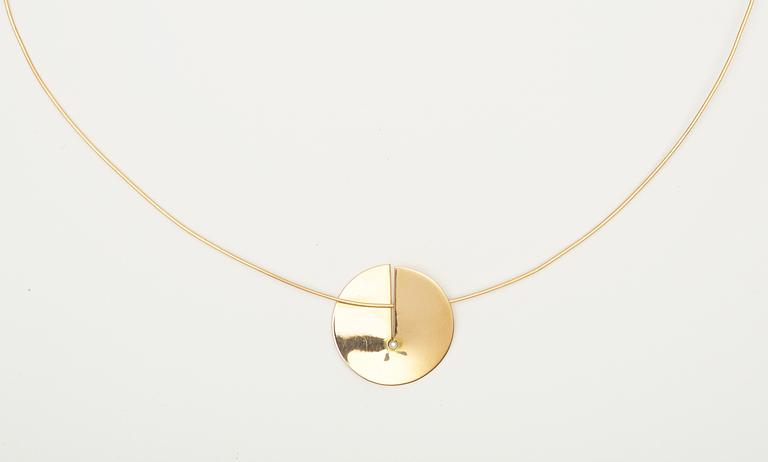A Helena Edman 18k gold necklace with brilliant cut diamond.