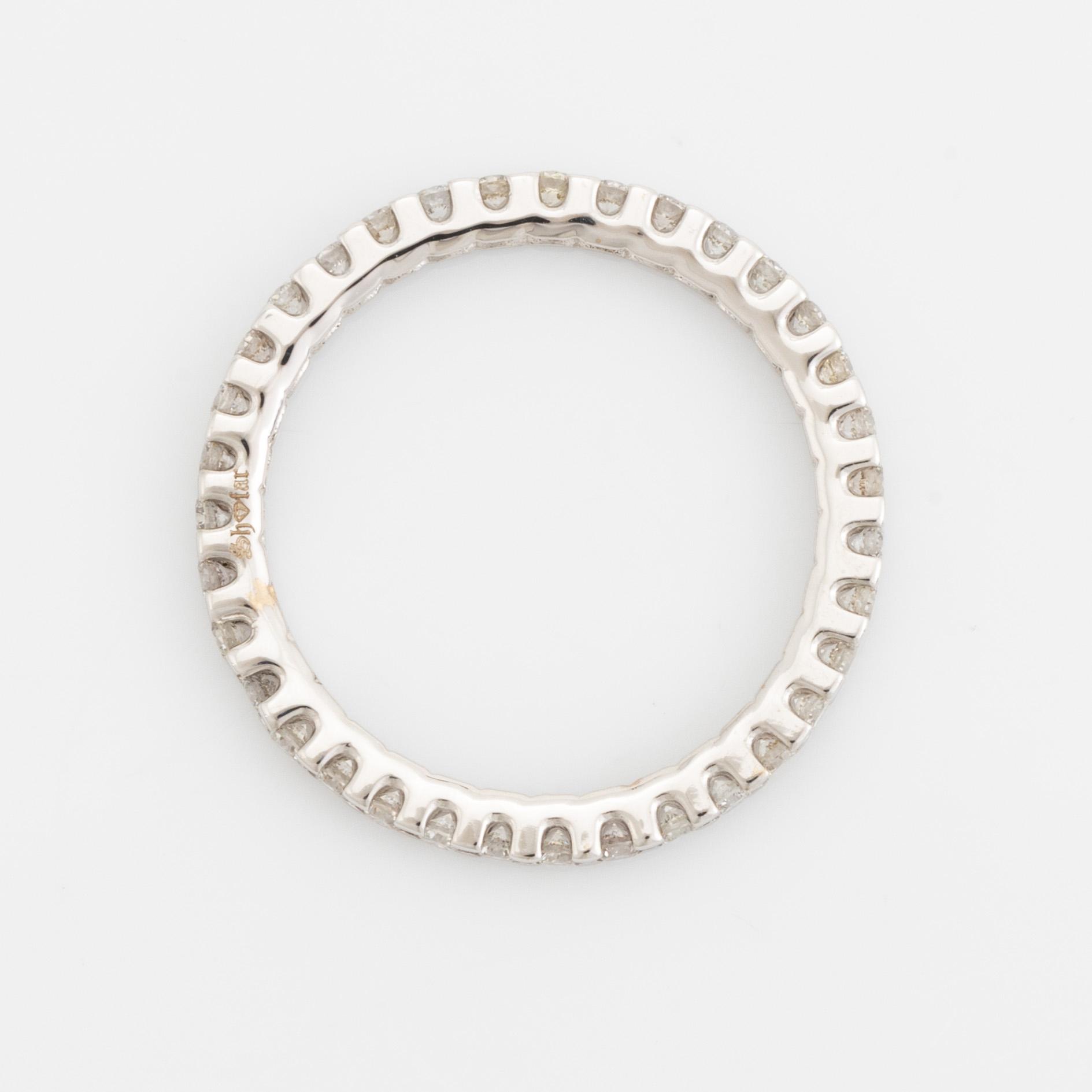 Brilliant-cut diamond eternity ring.