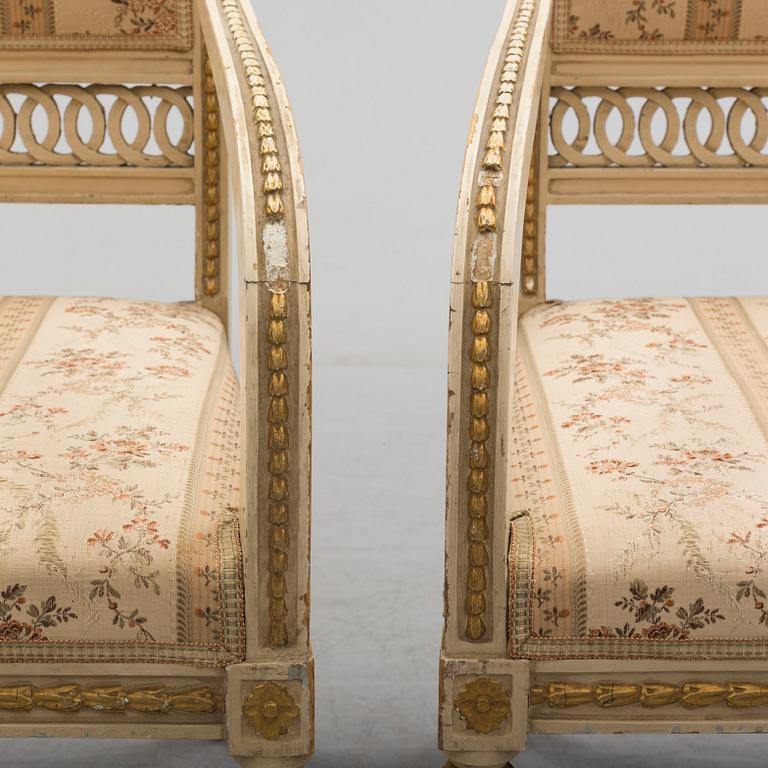 A pair of first half of the 19th century Empire arm chairs.