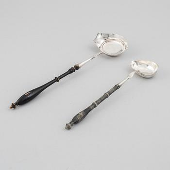 Two Swedish silver soup ladles, 19th Century.