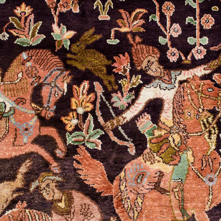 A silk on cotton figural carpet from Kashmir, around 362 x 271 cm.