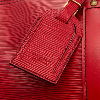 A RED EPI LEATHER KEEPALL TRAVEL BAG.