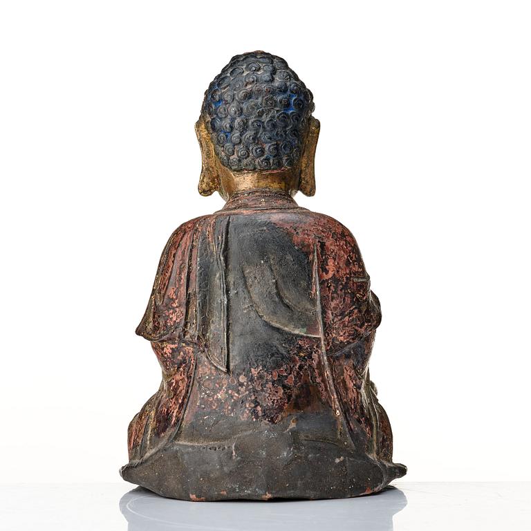 A seated bronze figure of buddha, Ming dynasty (1368-1644).