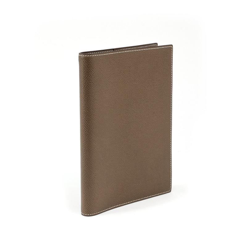 HERMÈS, a grey leather agenda cover, "Globe Trotter".