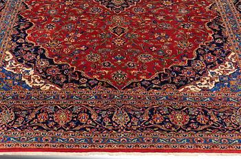 A carpet, Kashan, signed, ca 353 x 287 cm.