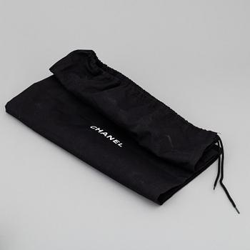 CHANEL, a pair of black leather boots, size 35,5.