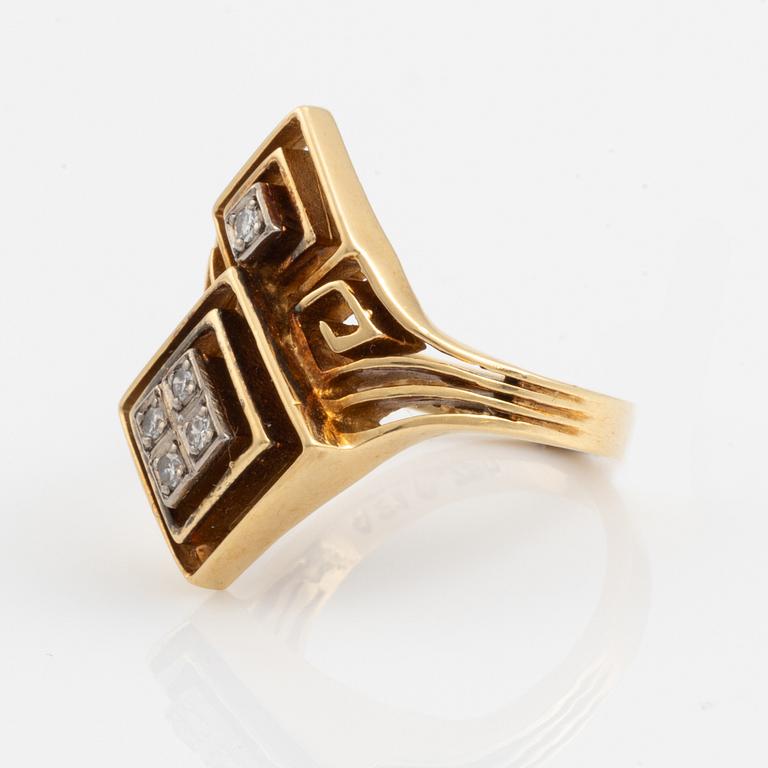 An Ilias Lalaounis ring in 18K gold set with eight-cut diamonds.