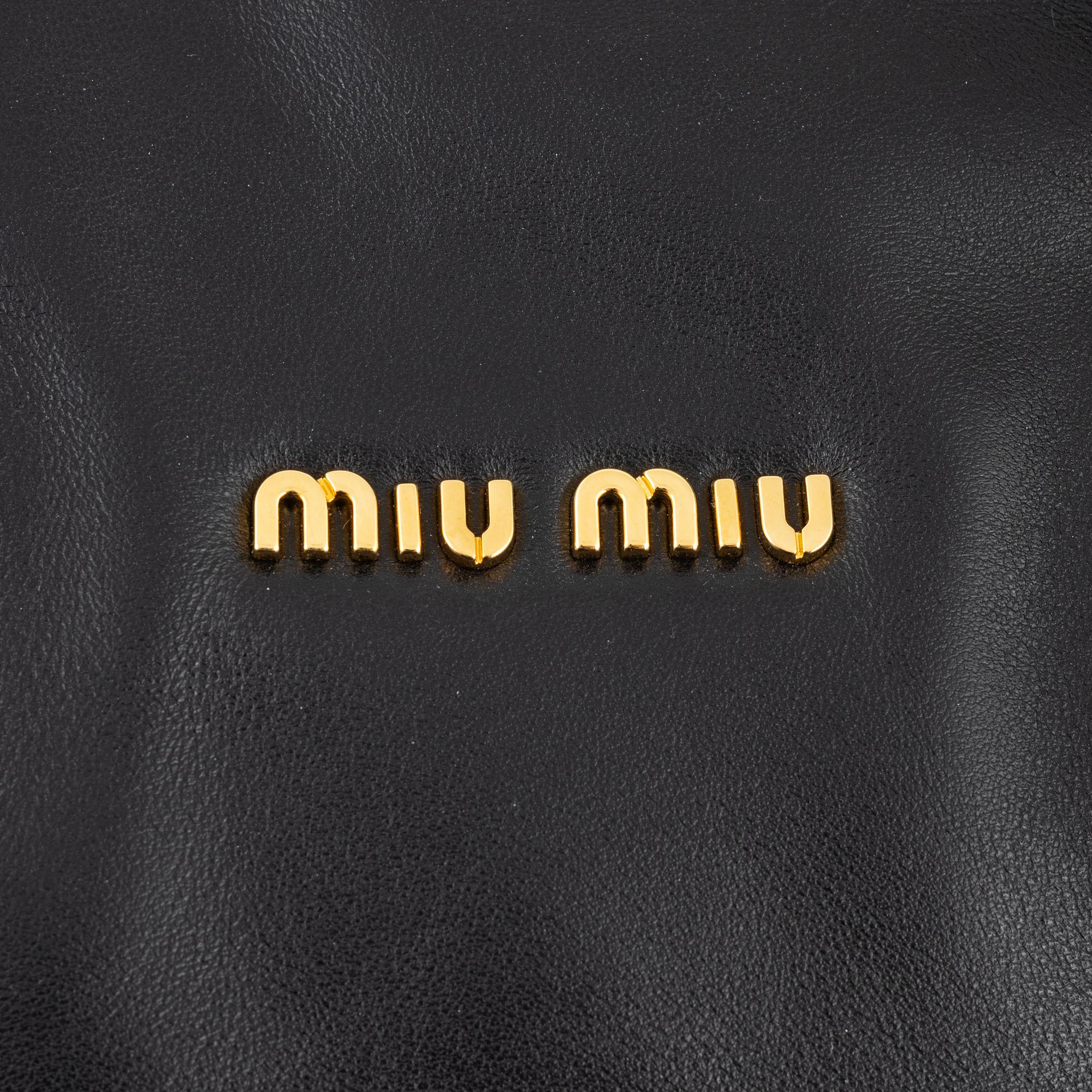 Miu Miu, a black leather handbag.