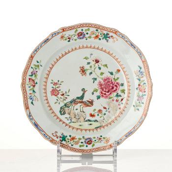 A group of famille rose 'double peacock' serving dishes, Qing dynasty, Qianlong (1736-95). (8 pieces).