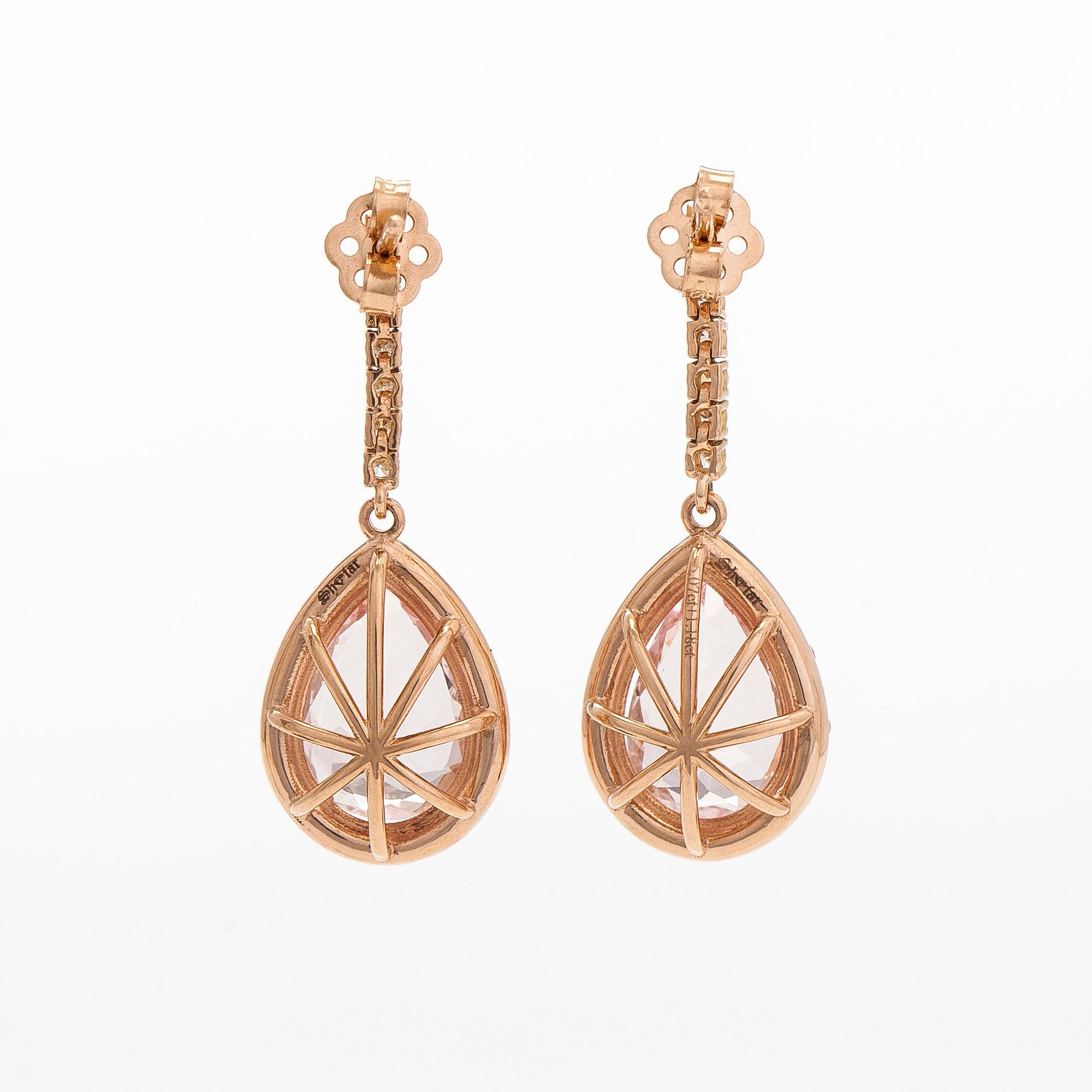 A pair of 18K gold earrings, with pear-cut morganites and diamonds.