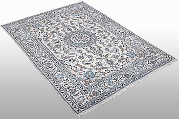 A carpet, Nain part silk, ca 305 x 191 cm.