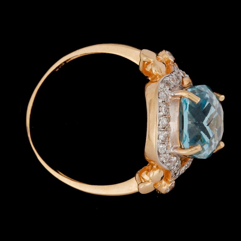 An aquamarine and white sapphire ring.