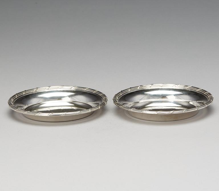 A matched pair of Swedish 19th century silver coasters, marked Mollenborg, Stockholm 1894 and 1900.